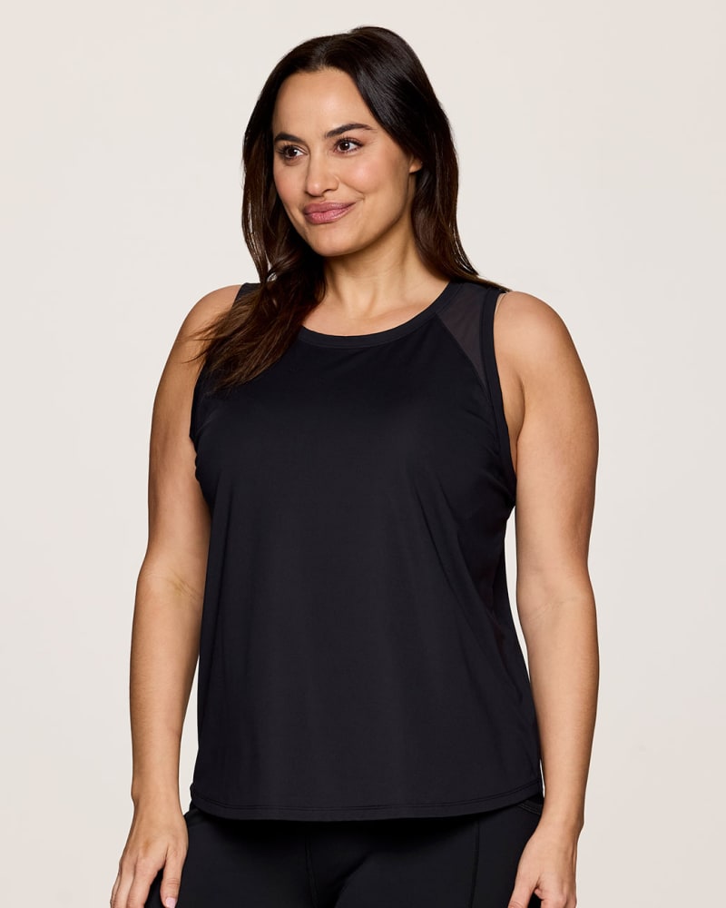 Front of a model wearing a size 3X Plus On The Run Tank in Black by RBX Active. | dia_product_style_image_id:348440